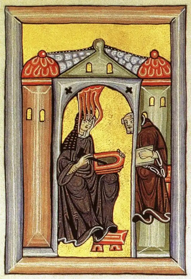 Mittelalterliche Illumination zu Hildegard von Bingen: Eine Person hält einen geschliffenen Stein, im Hintergrund ein Mönch.