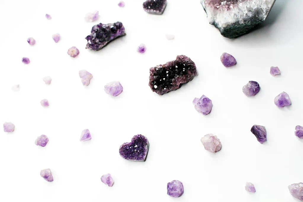 purple and white stones on white surface