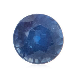 Runder blauer Edelstein mit mehreren Facetten, die das Licht reflektieren und verschiedene Blautöne aufweisen.